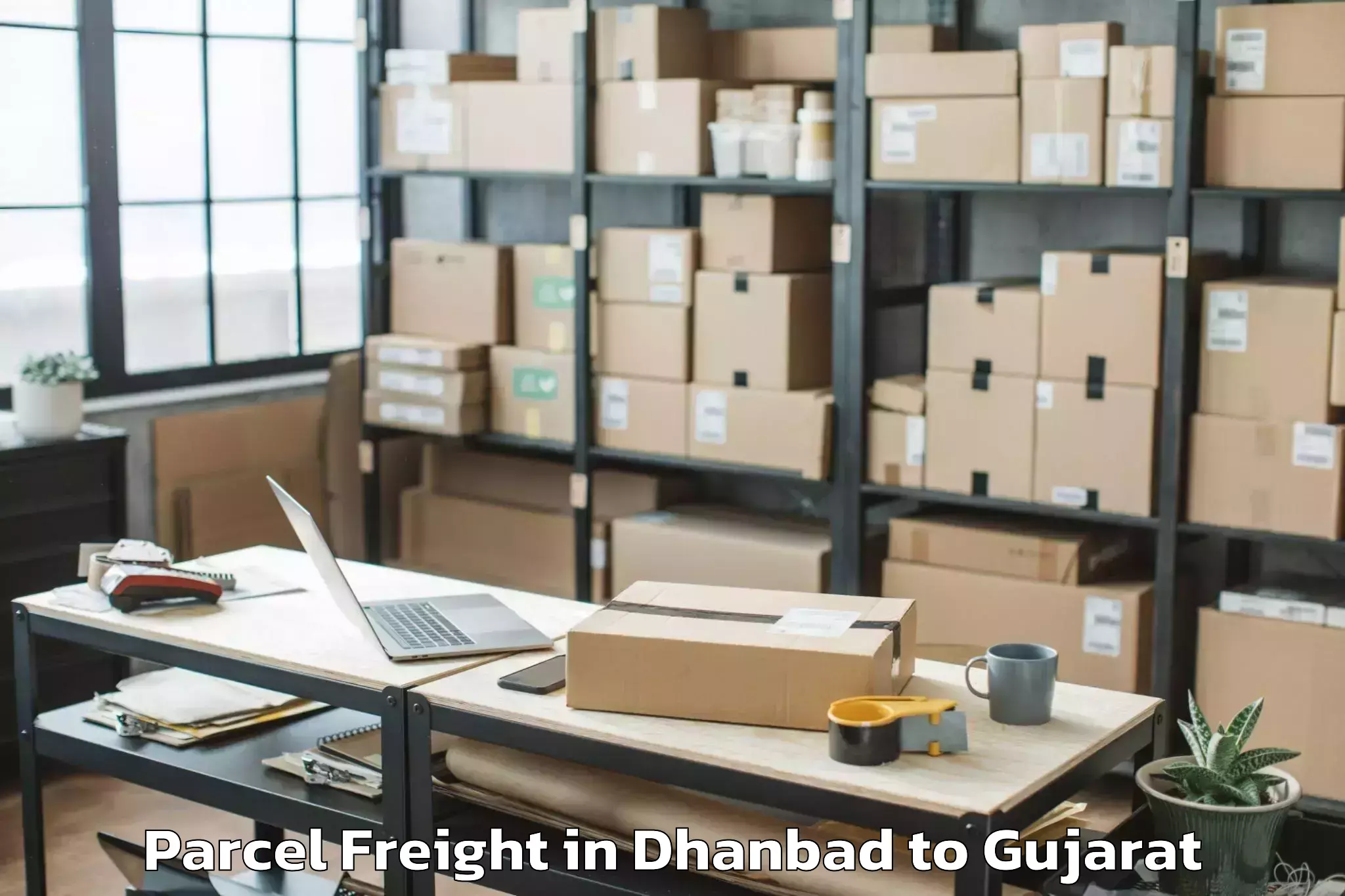 Book Dhanbad to Idar Parcel Freight Online